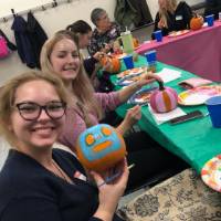 student showing their pumpkins